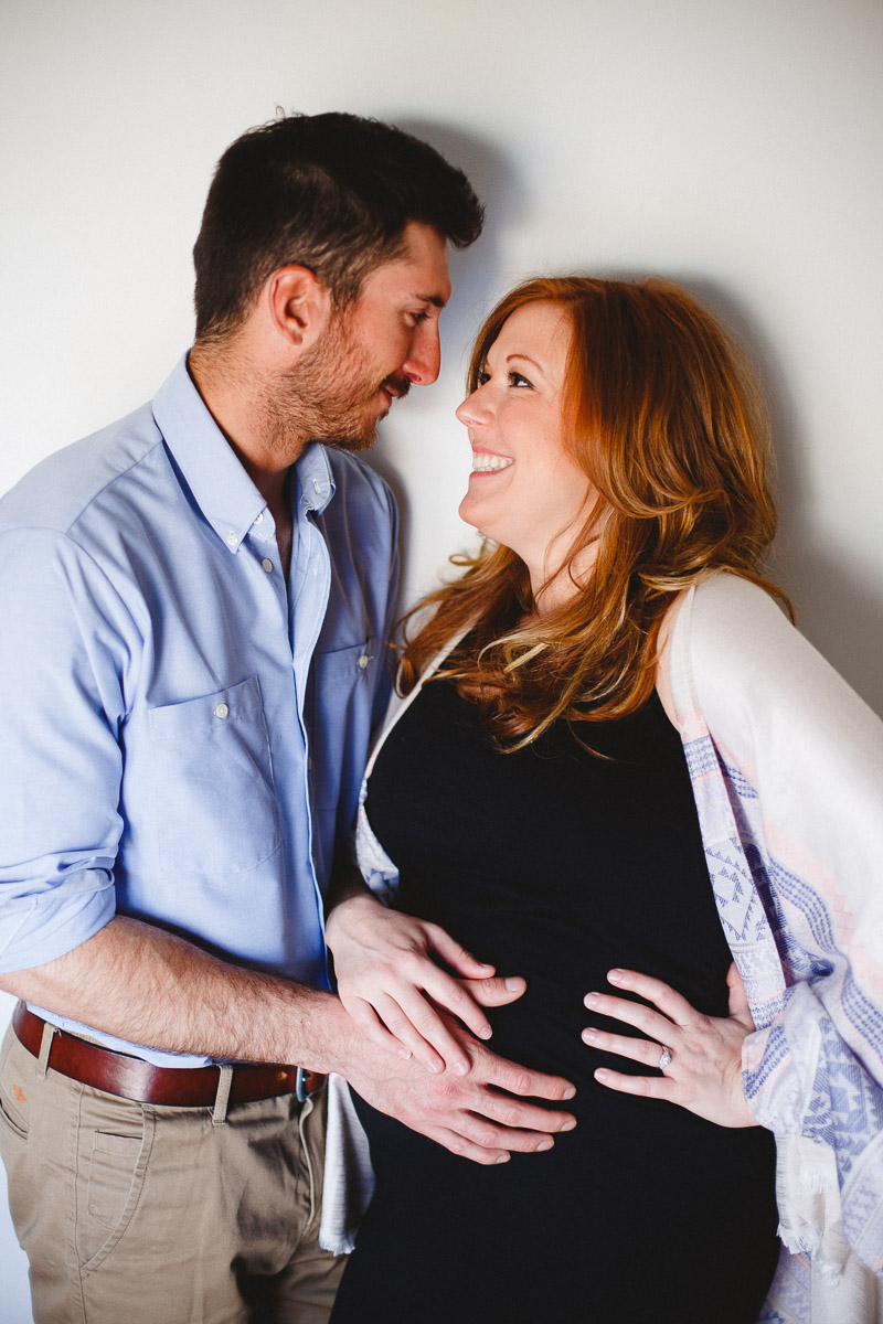 couple's maternity session at their modern boho chic winnipeg home