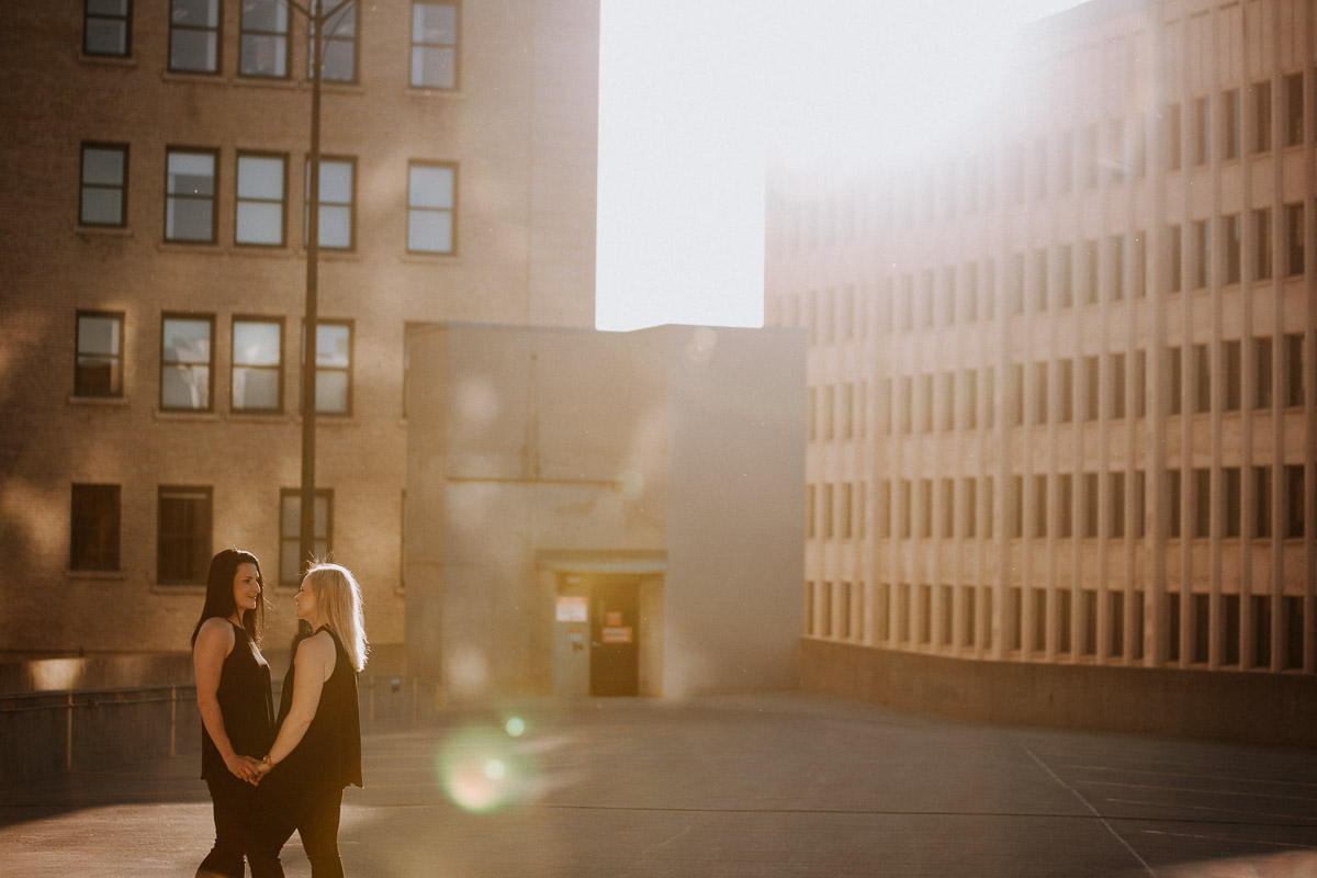 Engagement session in summer at golden hour on rooftop downtown Winnipeg